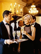 Adults at a party with champagne