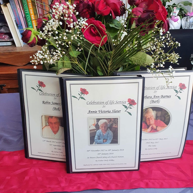 Some example eulogies against a vase of red roses