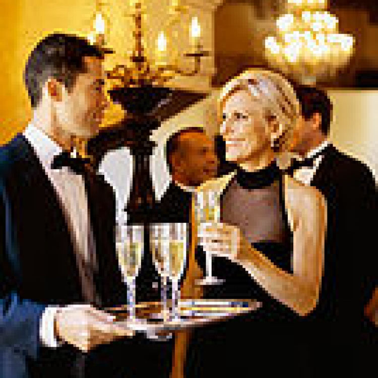 Adults at a party with champagne